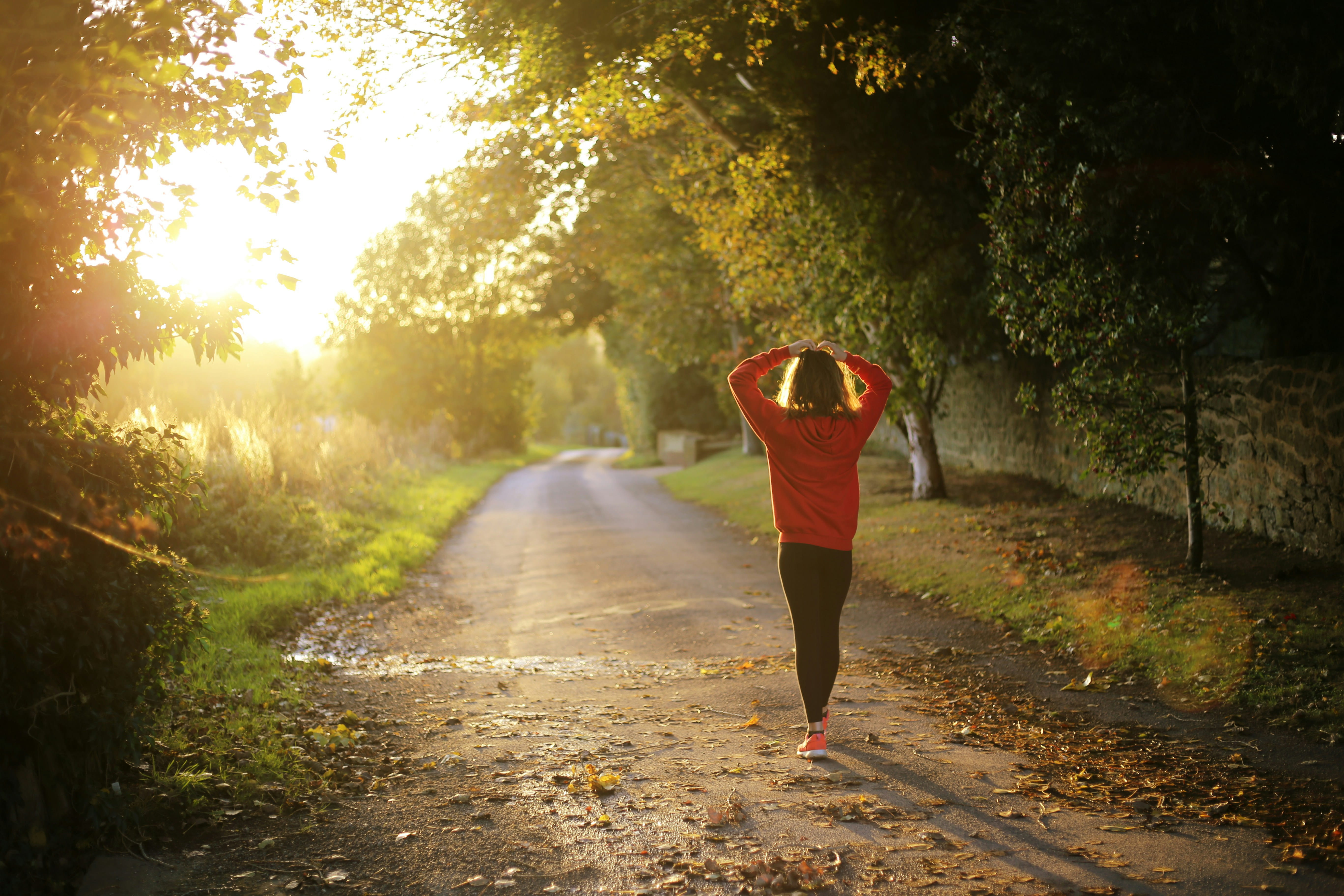 Woman walking through forest