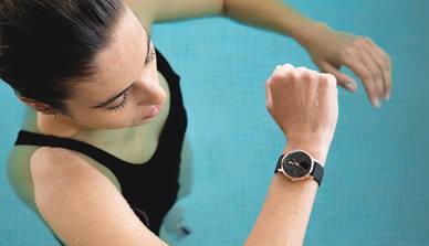 Woman swimming wearing Withings Steel watch