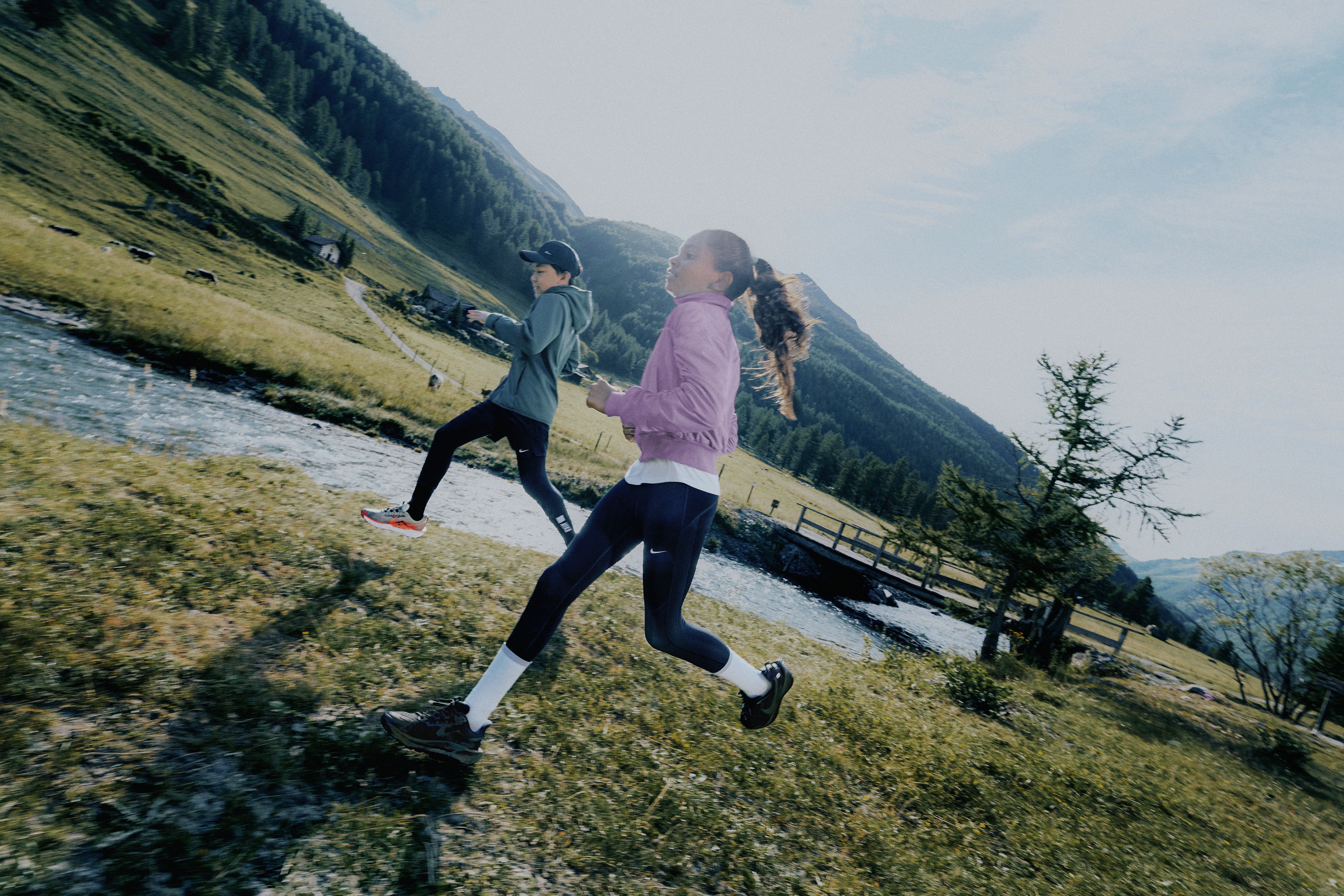 Two people running in countryside