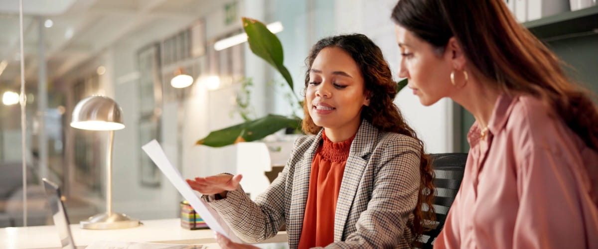 a-financial-adviser-showing-aclient-paperwork