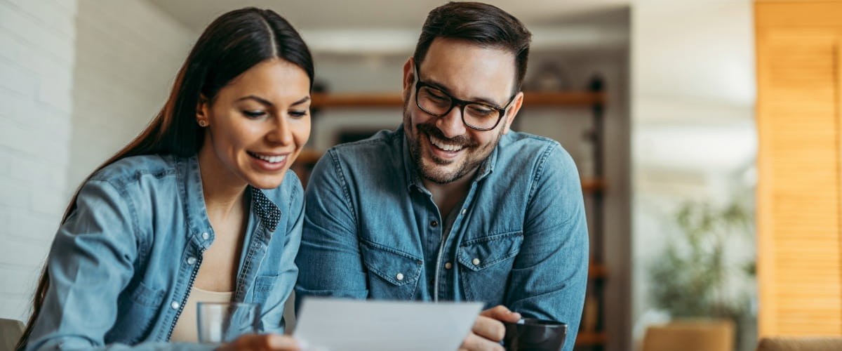 couple-looking-at-paperwork-together