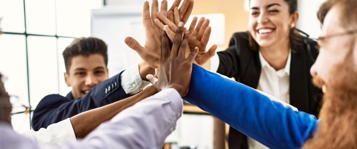 group-of-happy-employees-high-fiving