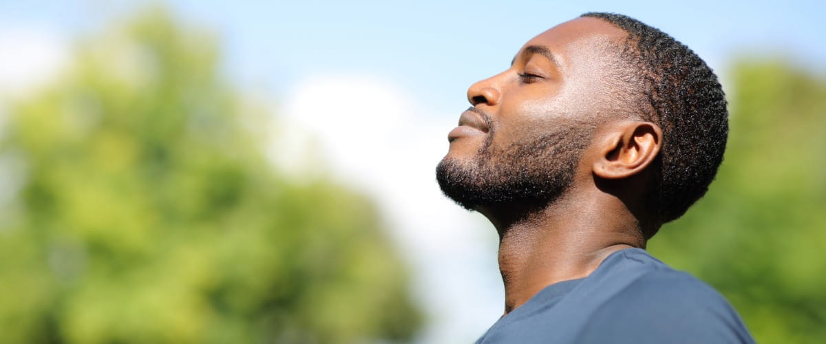 man-smiling-in-nature