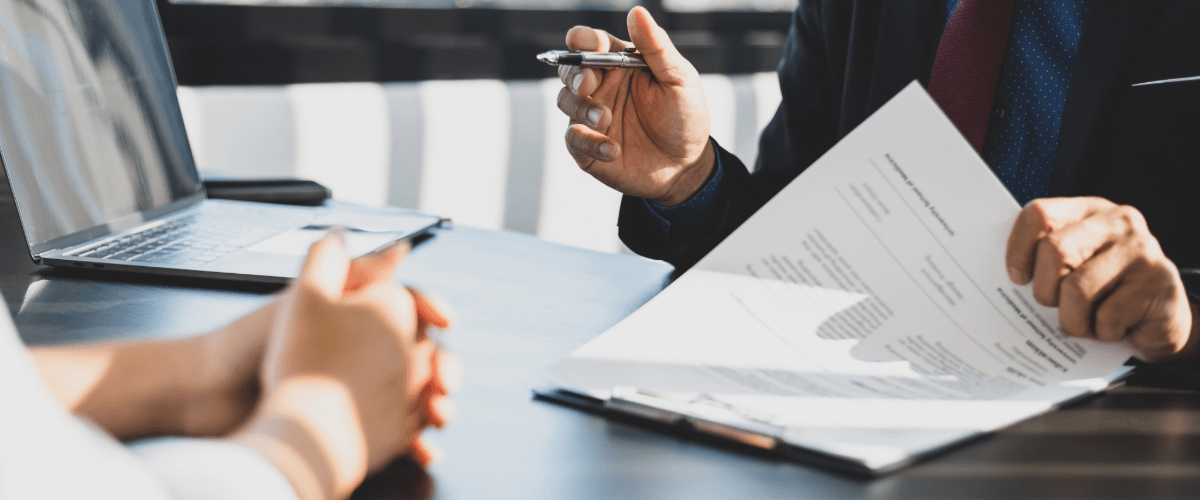 office-worker-with-clipboard-and-pen-in-meeting