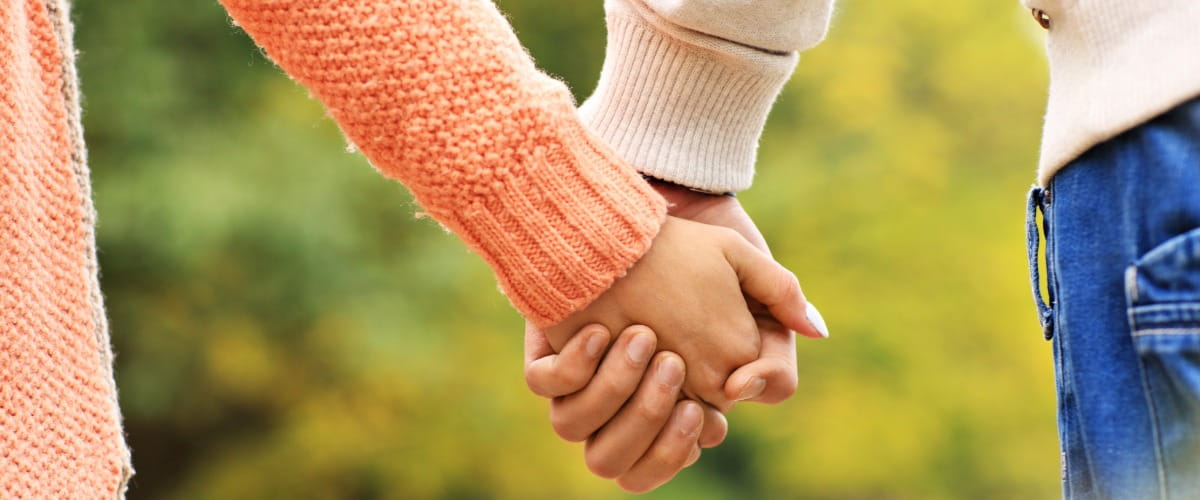 two-people-holding-hands