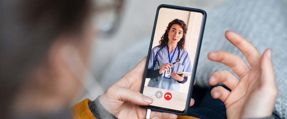 patient-on-virtual-appointment-with-female-doctor