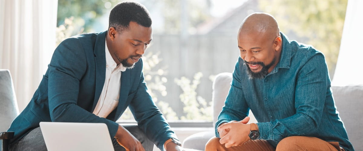 two-men-in-a-business-meeting-looking-at-paperwork