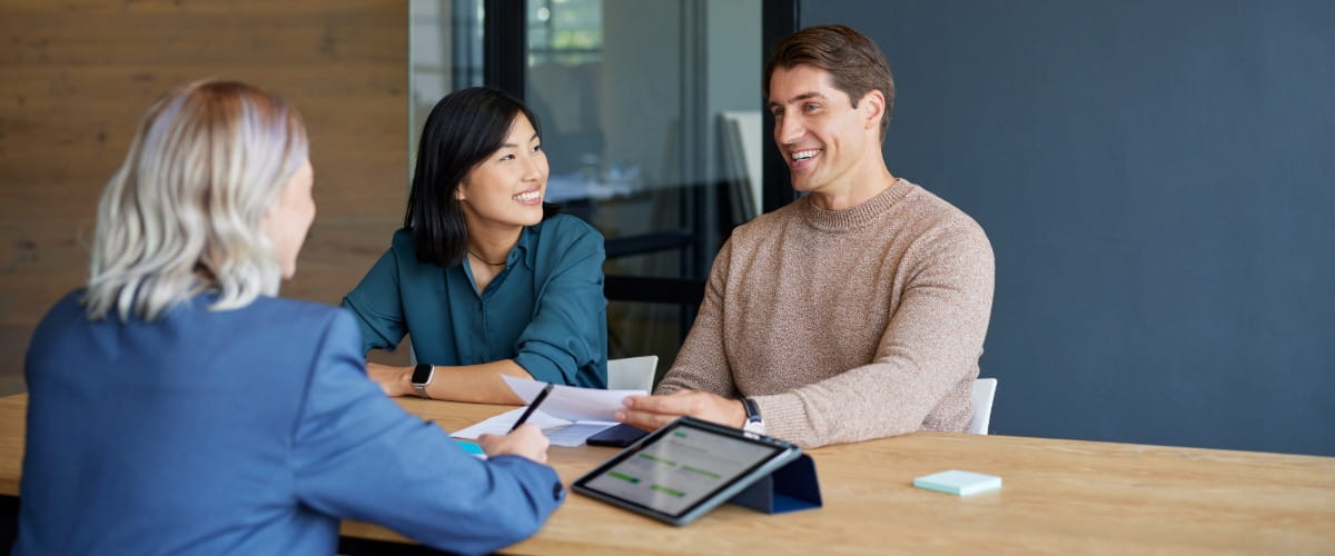 mortgage-adviser-smiling-couple