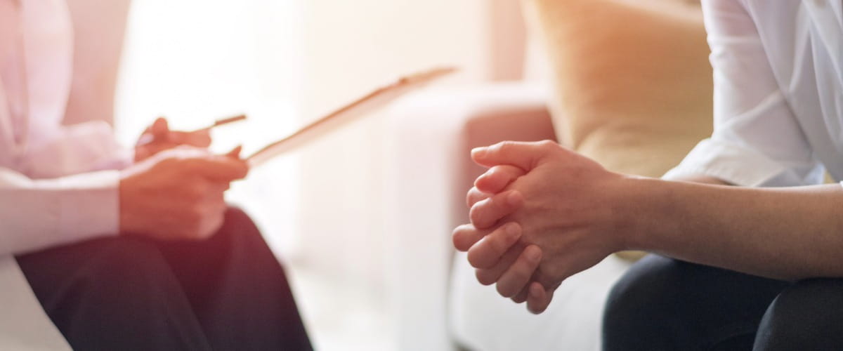 mental-health-therapy-clasped-hands